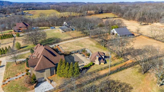 birds eye view of property with a rural view