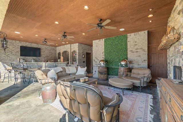 view of patio / terrace with outdoor lounge area, an outdoor bar, and ceiling fan