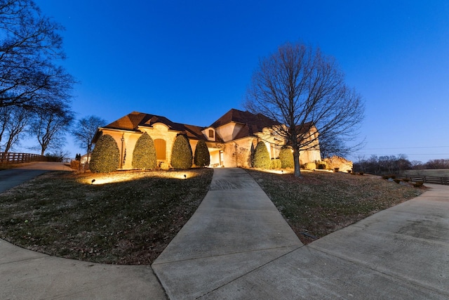 mediterranean / spanish-style home with a yard