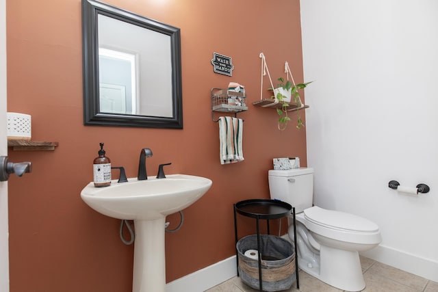 bathroom featuring tile patterned flooring and toilet