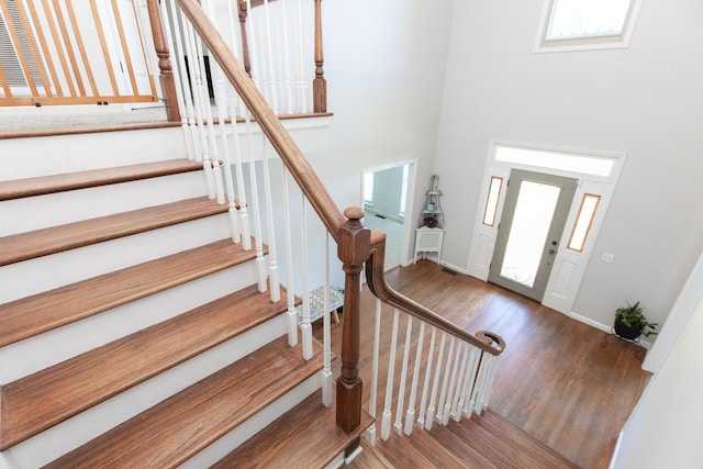 foyer with a healthy amount of sunlight and hardwood / wood-style flooring