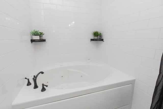 bathroom with a tub to relax in