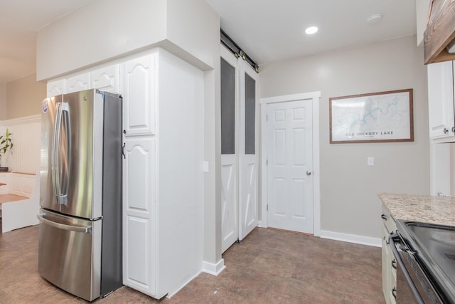 kitchen featuring stainless steel appliances and white cabinetry