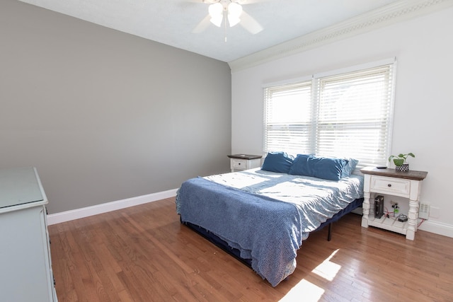 bedroom featuring ceiling fan and dark hardwood / wood-style flooring