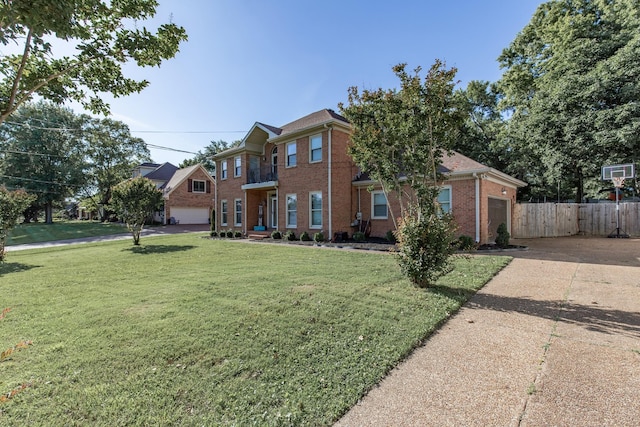 view of front facade with a front yard and a garage