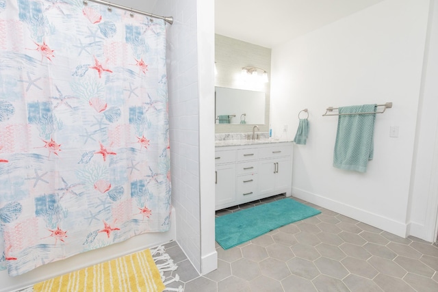 bathroom featuring tile patterned floors, vanity, and shower / tub combo with curtain