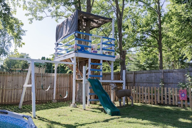 view of jungle gym featuring a lawn