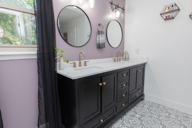 bathroom with tile patterned floors and vanity