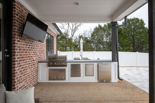 view of patio with a grill and area for grilling