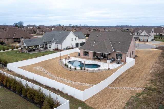 view of pool featuring a patio and a grill