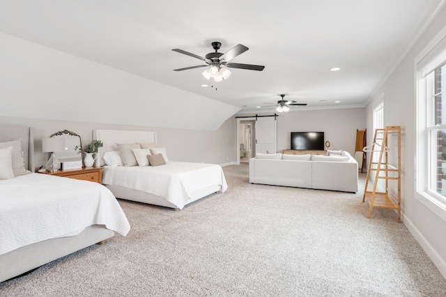 carpeted bedroom with ceiling fan, a barn door, ornamental molding, and vaulted ceiling