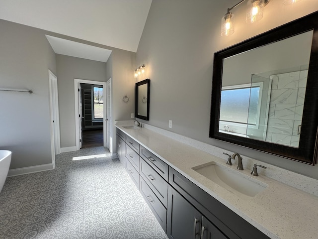 bathroom with plus walk in shower, vanity, and lofted ceiling