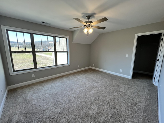 interior space featuring ceiling fan and vaulted ceiling