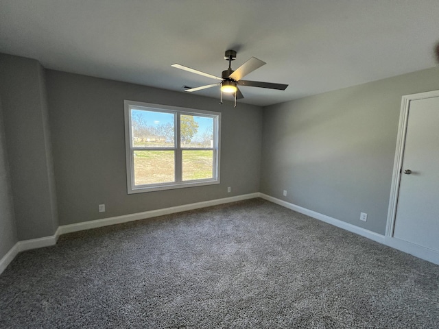 spare room with ceiling fan and carpet floors