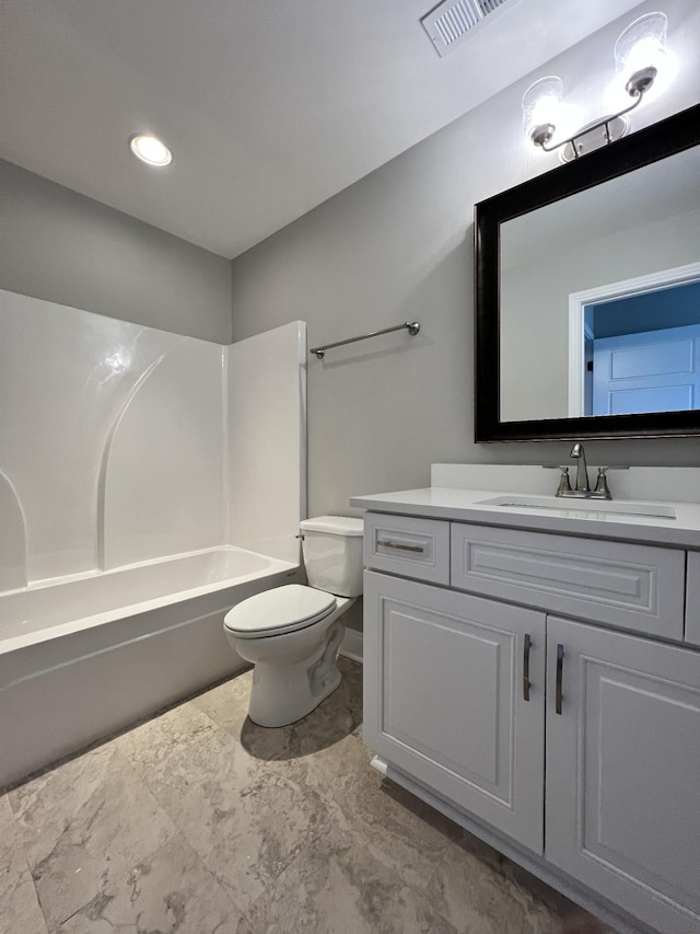 full bathroom featuring shower / bathing tub combination, vanity, and toilet