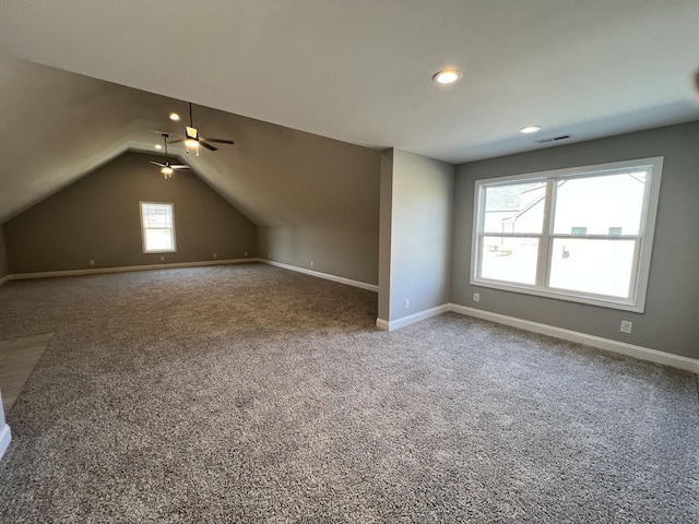 bonus room featuring carpet flooring, plenty of natural light, ceiling fan, and lofted ceiling