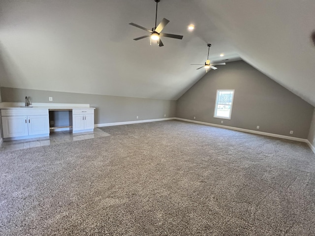 bonus room featuring carpet, vaulted ceiling, ceiling fan, and sink