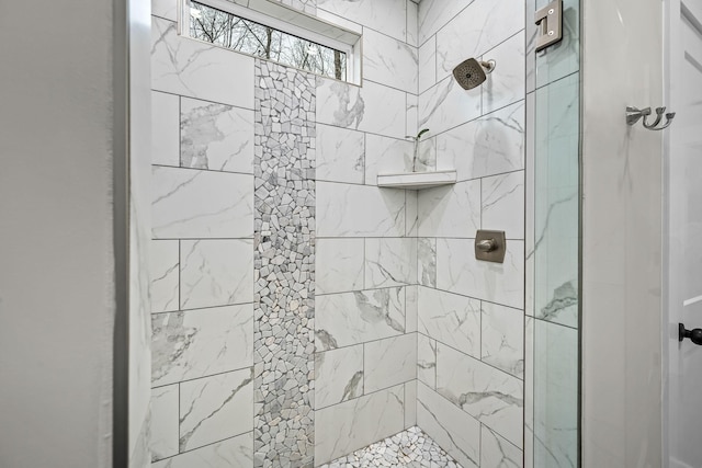 bathroom featuring tiled shower