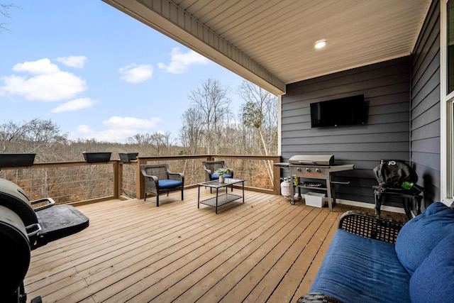 wooden terrace featuring grilling area