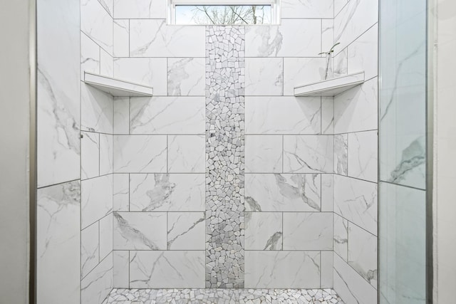 details with a tile shower