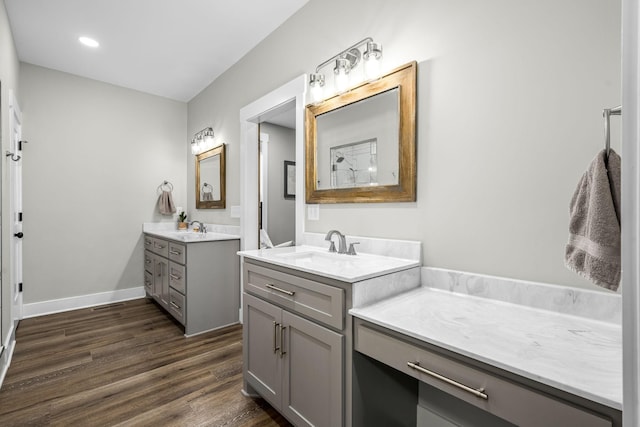 bathroom with vanity and wood-type flooring