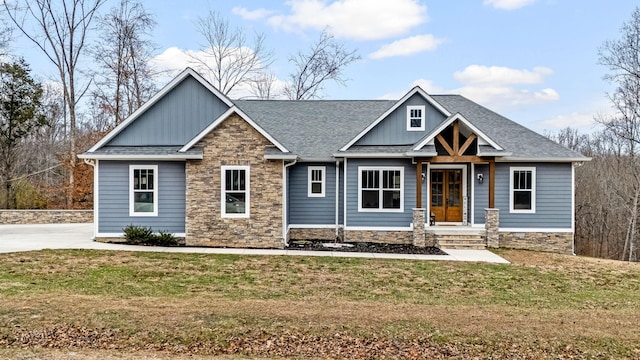 craftsman inspired home with a front lawn