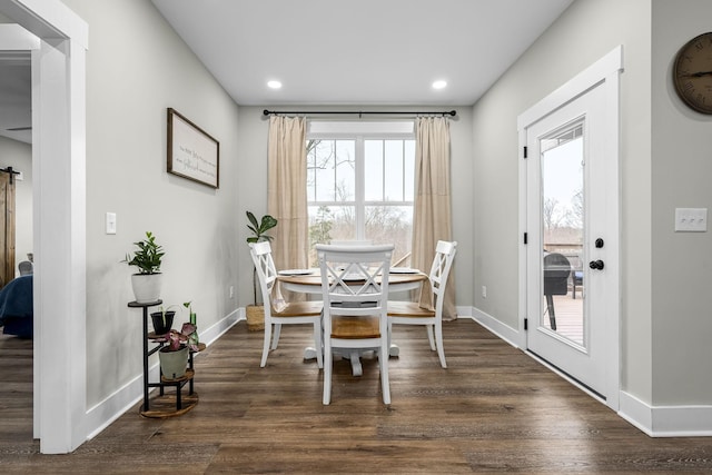 dining room with dark hardwood / wood-style flooring