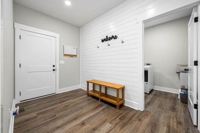 interior space featuring washer / dryer and dark hardwood / wood-style flooring