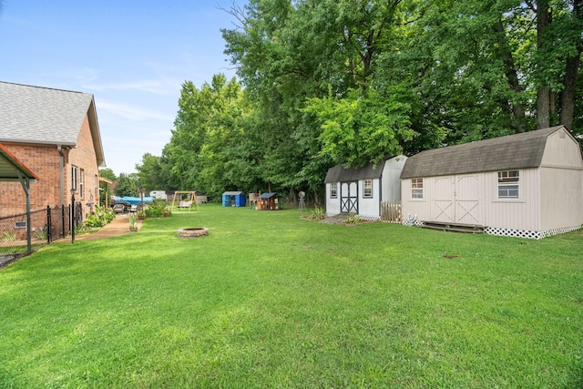 view of yard featuring an outdoor fire pit