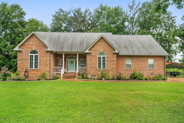 view of front of house with a front lawn, a porch, and a carport