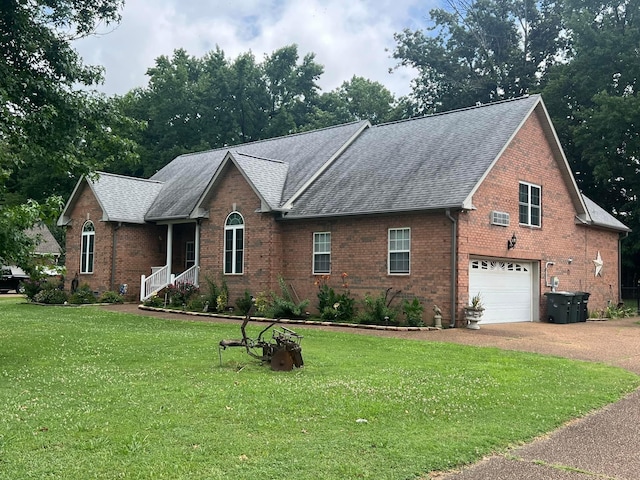 view of front facade featuring a wall mounted AC, a garage, and a front lawn