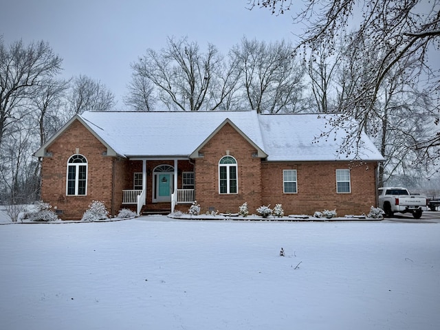 single story home featuring covered porch