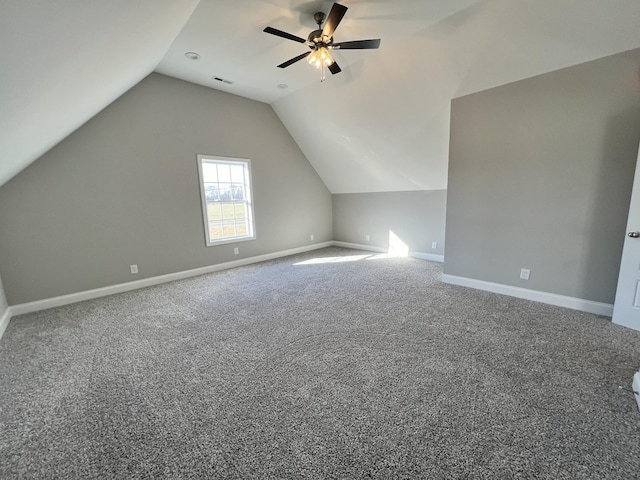 additional living space with carpet flooring, ceiling fan, and lofted ceiling