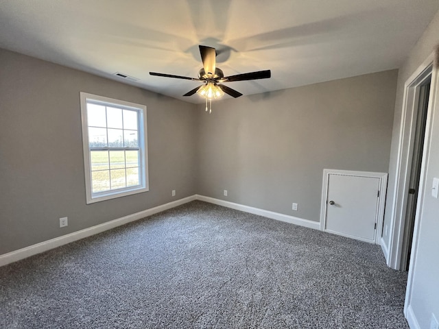 carpeted empty room with ceiling fan