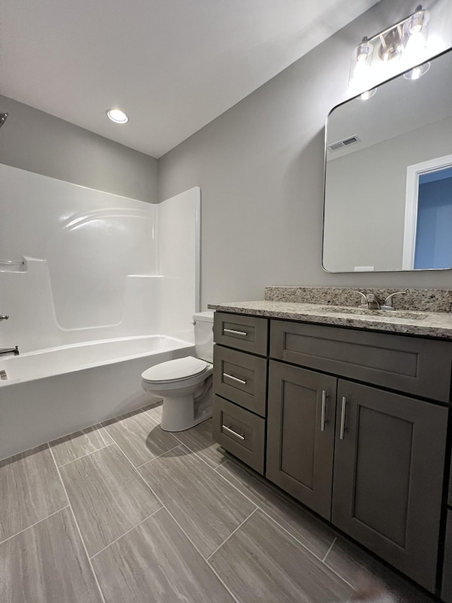 full bathroom with vanity, toilet, and shower / bath combination