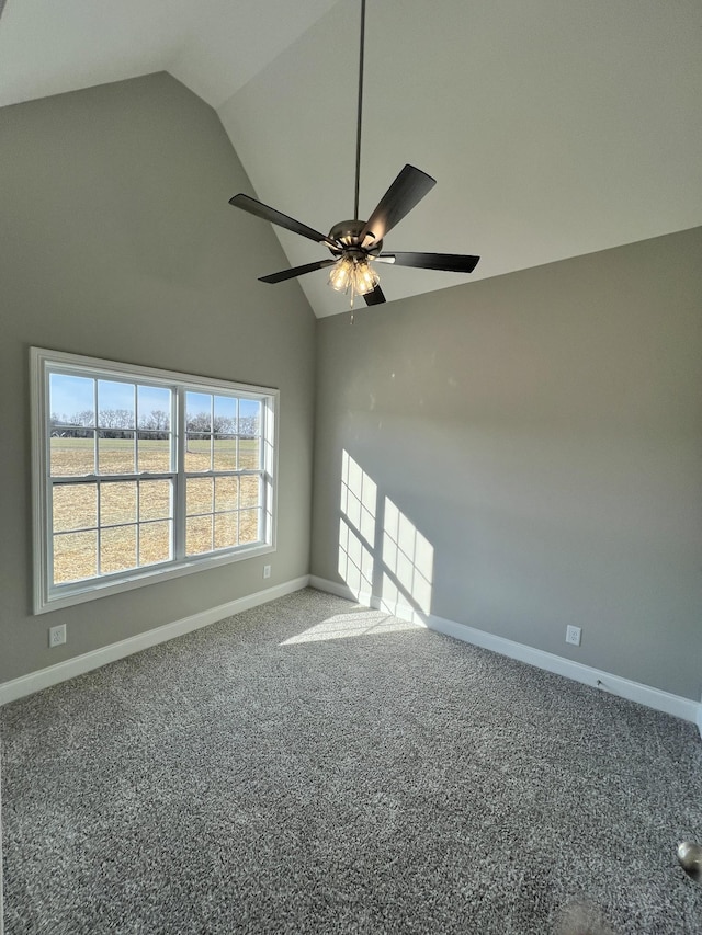 carpeted empty room featuring ceiling fan and lofted ceiling