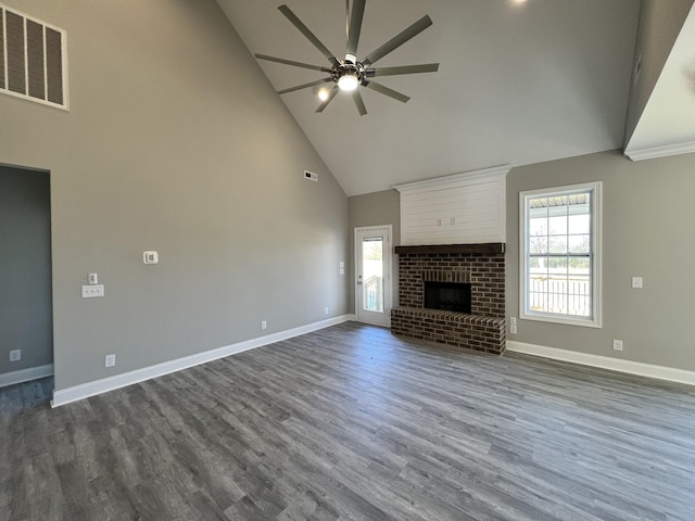 unfurnished living room featuring ceiling fan, a fireplace, high vaulted ceiling, and dark hardwood / wood-style floors