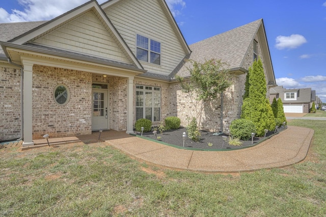 rear view of house with a lawn