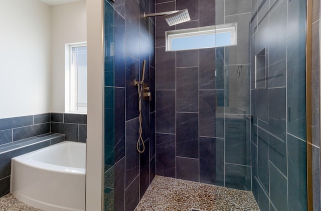 bathroom with separate shower and tub