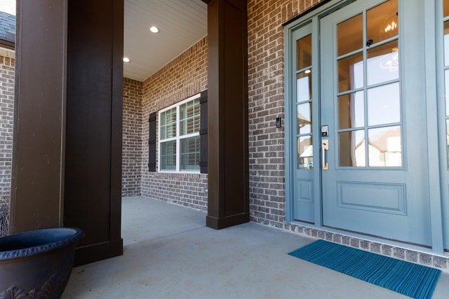 view of exterior entry featuring a porch