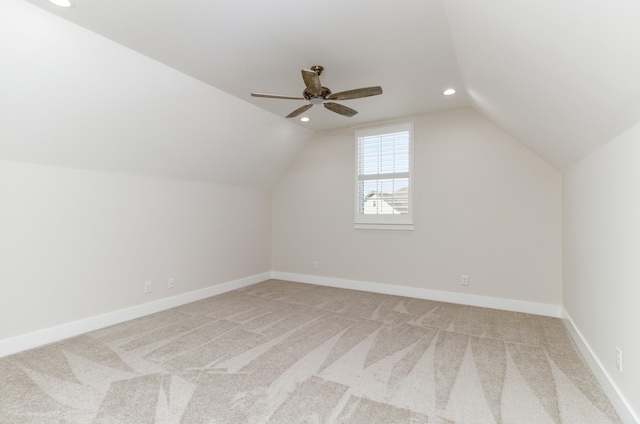 bonus room featuring light carpet, ceiling fan, and vaulted ceiling