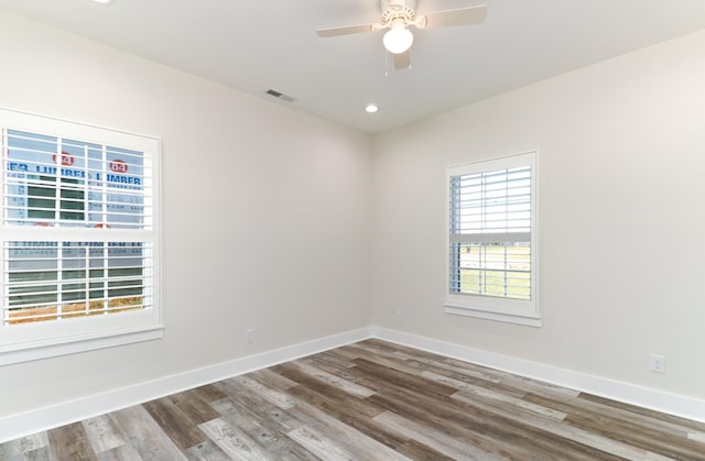 empty room featuring ceiling fan and wood-type flooring