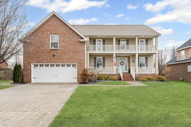 front of property featuring covered porch, a garage, a balcony, and a front yard