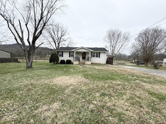 single story home featuring a front yard and a porch