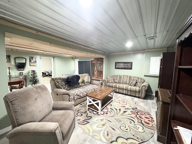 living room with hardwood / wood-style flooring and wooden ceiling