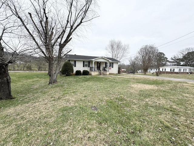 view of front of home with a front yard