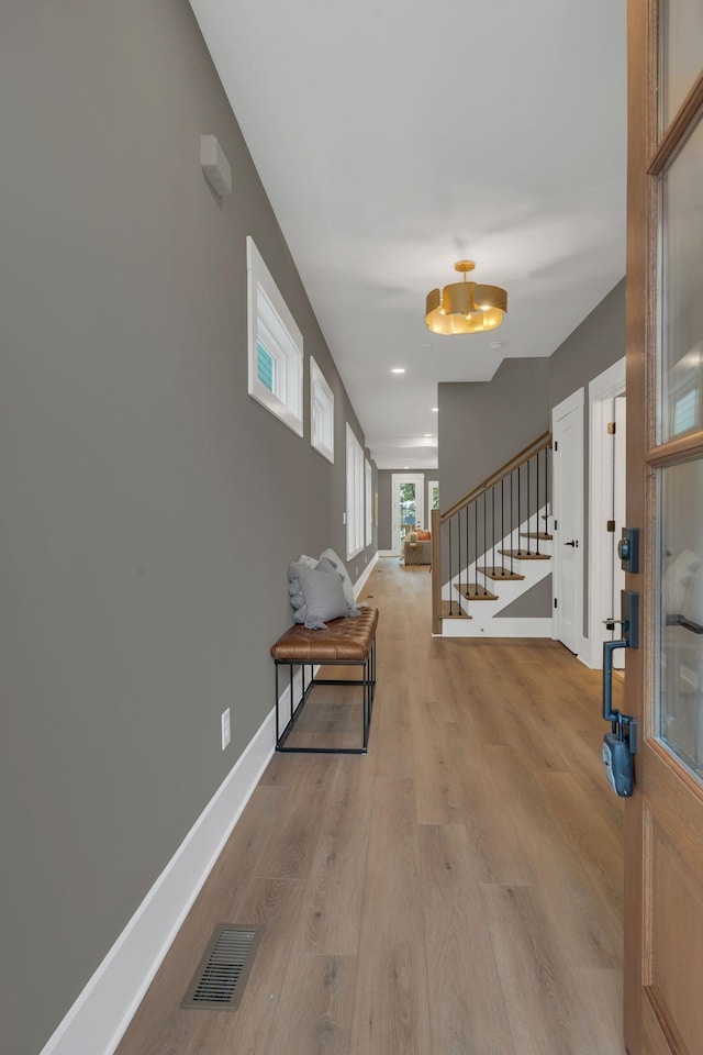 hallway with light wood-type flooring