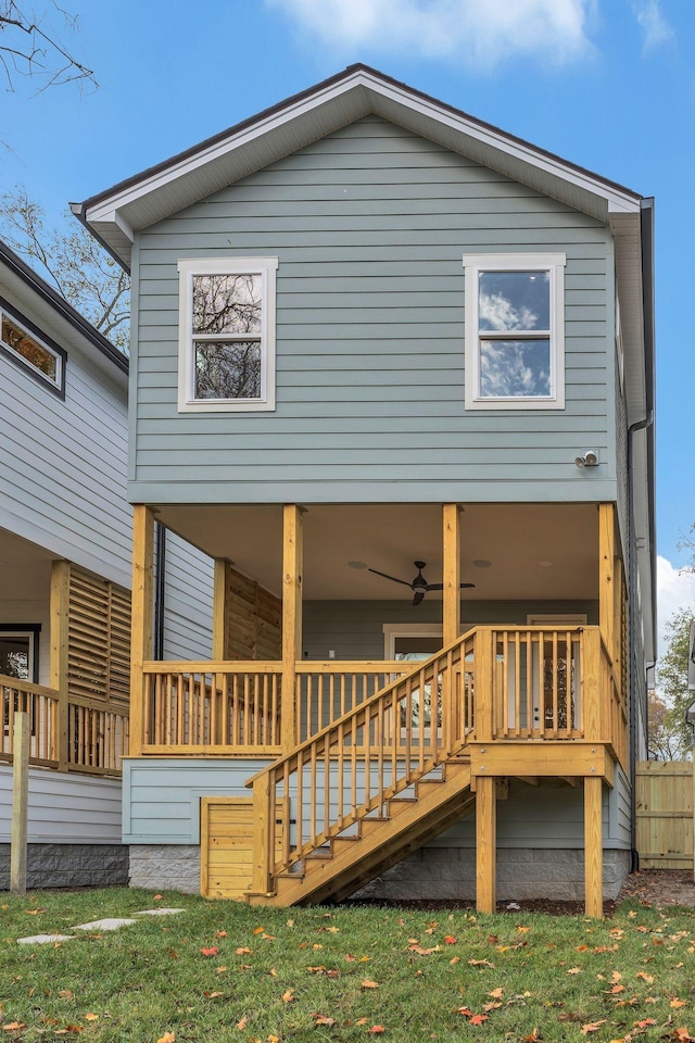 back of property featuring ceiling fan