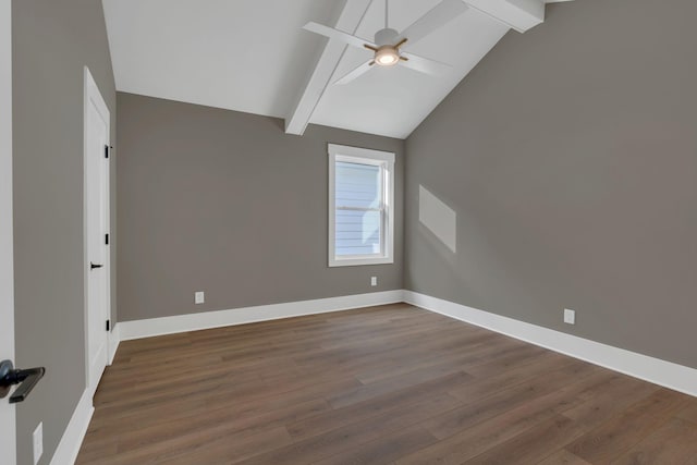 unfurnished room featuring ceiling fan, lofted ceiling with beams, and dark hardwood / wood-style floors