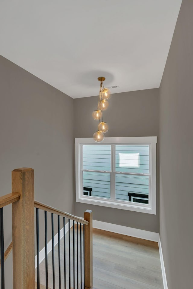 stairway with wood-type flooring